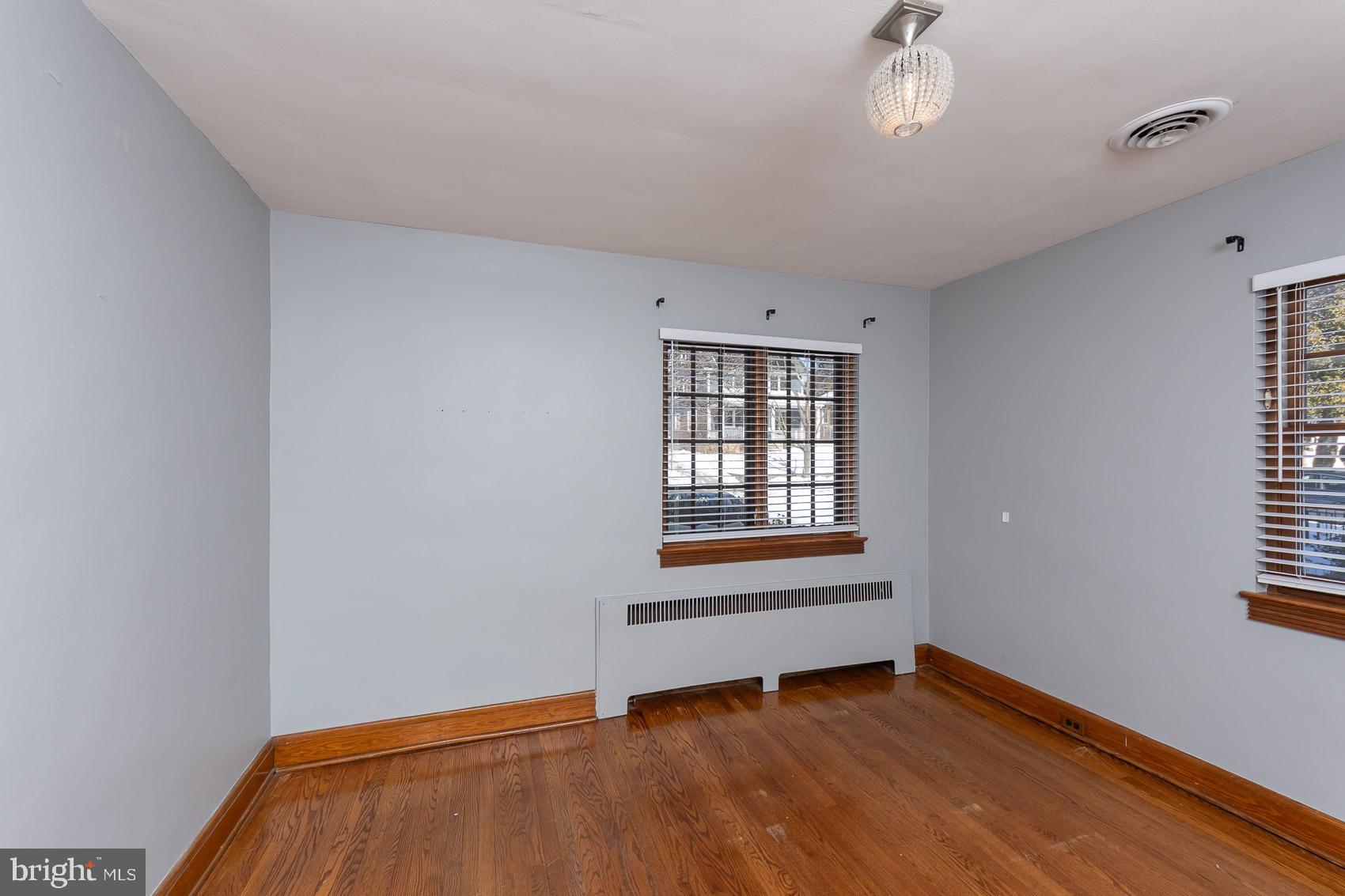613 Anneslie Road Baltimore, MD 21212 - Photo 32 of 48 a view of an empty room with wooden floor and a window