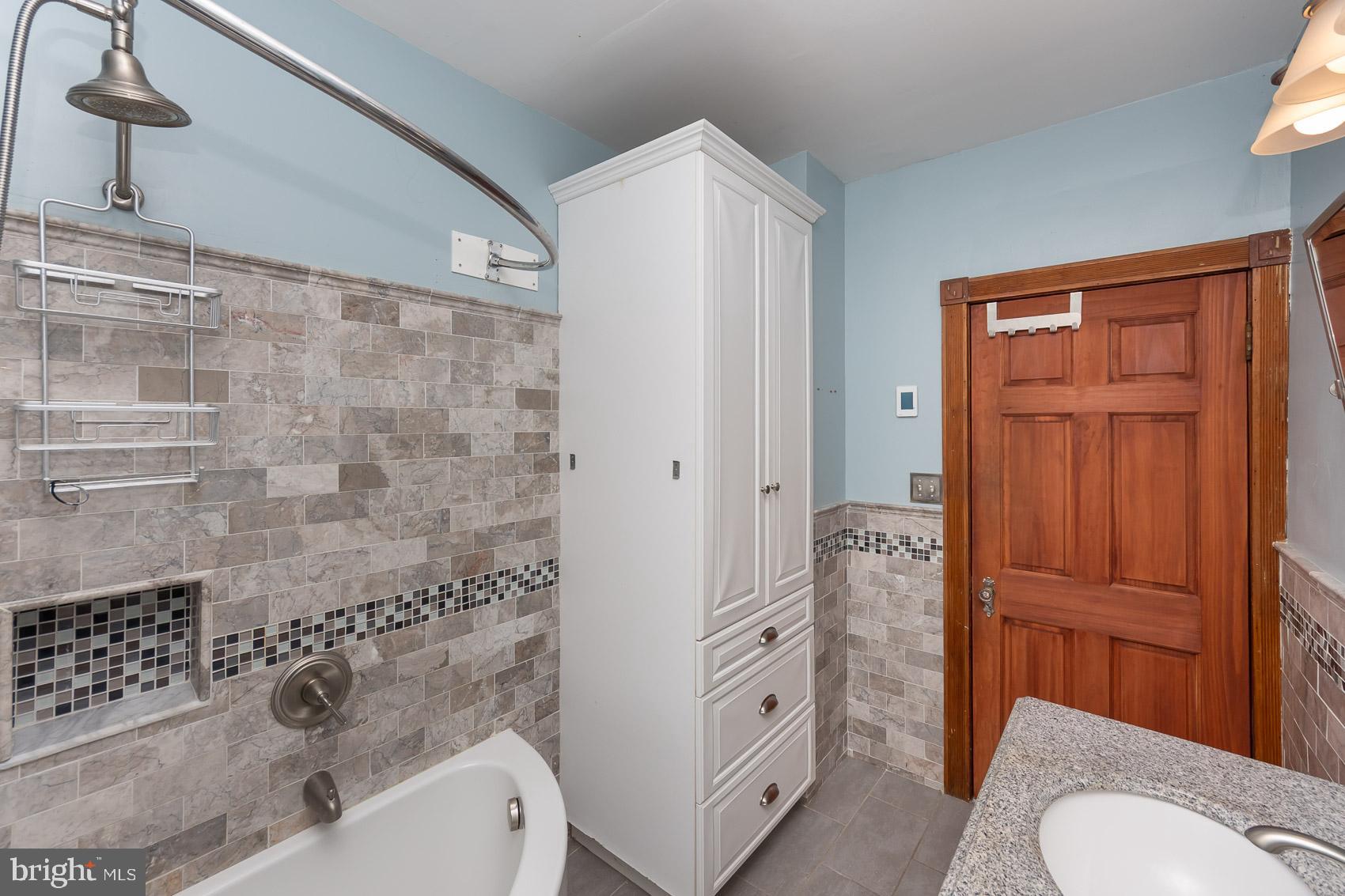 613 Anneslie Road Baltimore, MD 21212 - Photo 35 of 48 a bathroom with a sink a toilet and shower