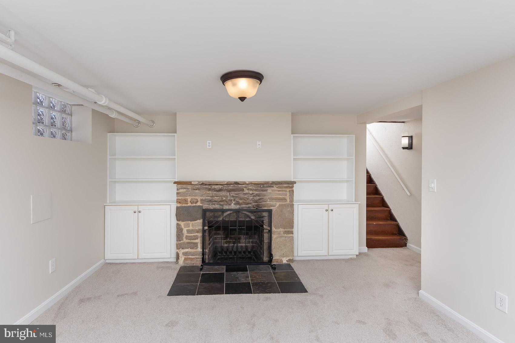 613 Anneslie Road Baltimore, MD 21212 - Photo 40 of 48 an empty room with windows and fireplace