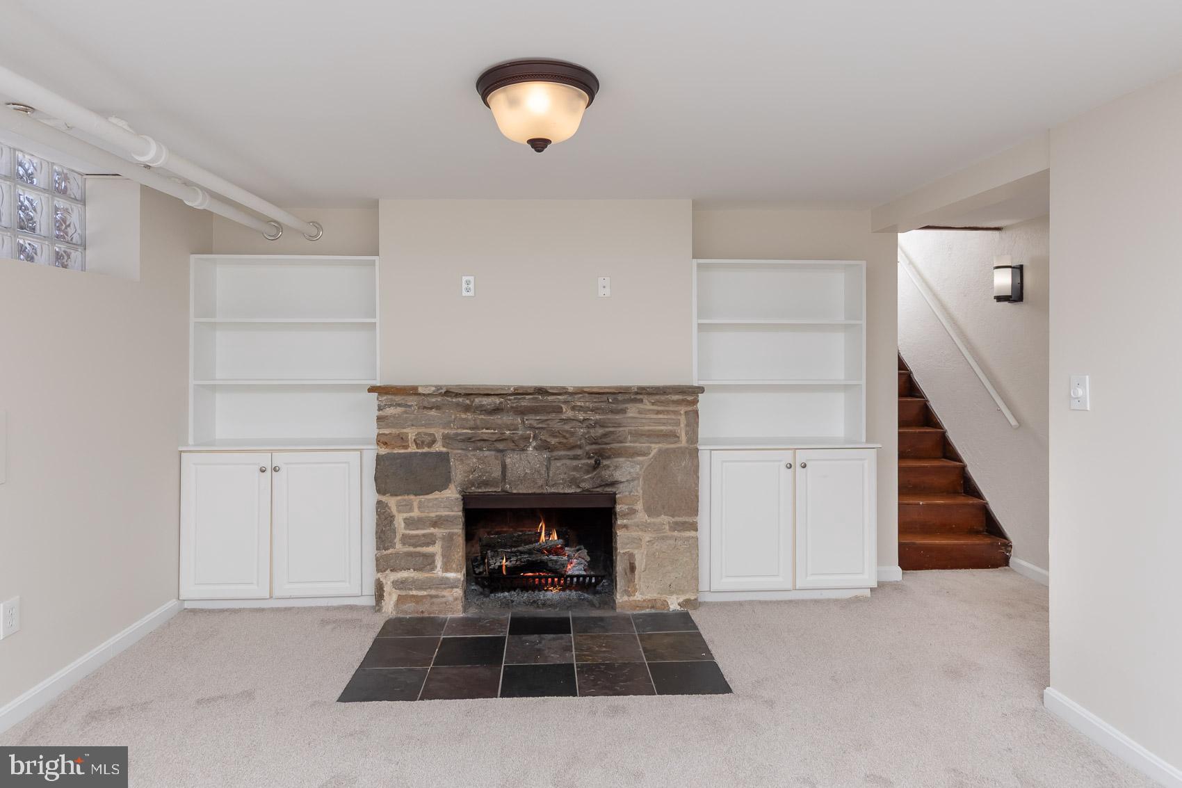 613 Anneslie Road Baltimore, MD 21212 - Photo 41 of 48 an empty room with windows and fireplace