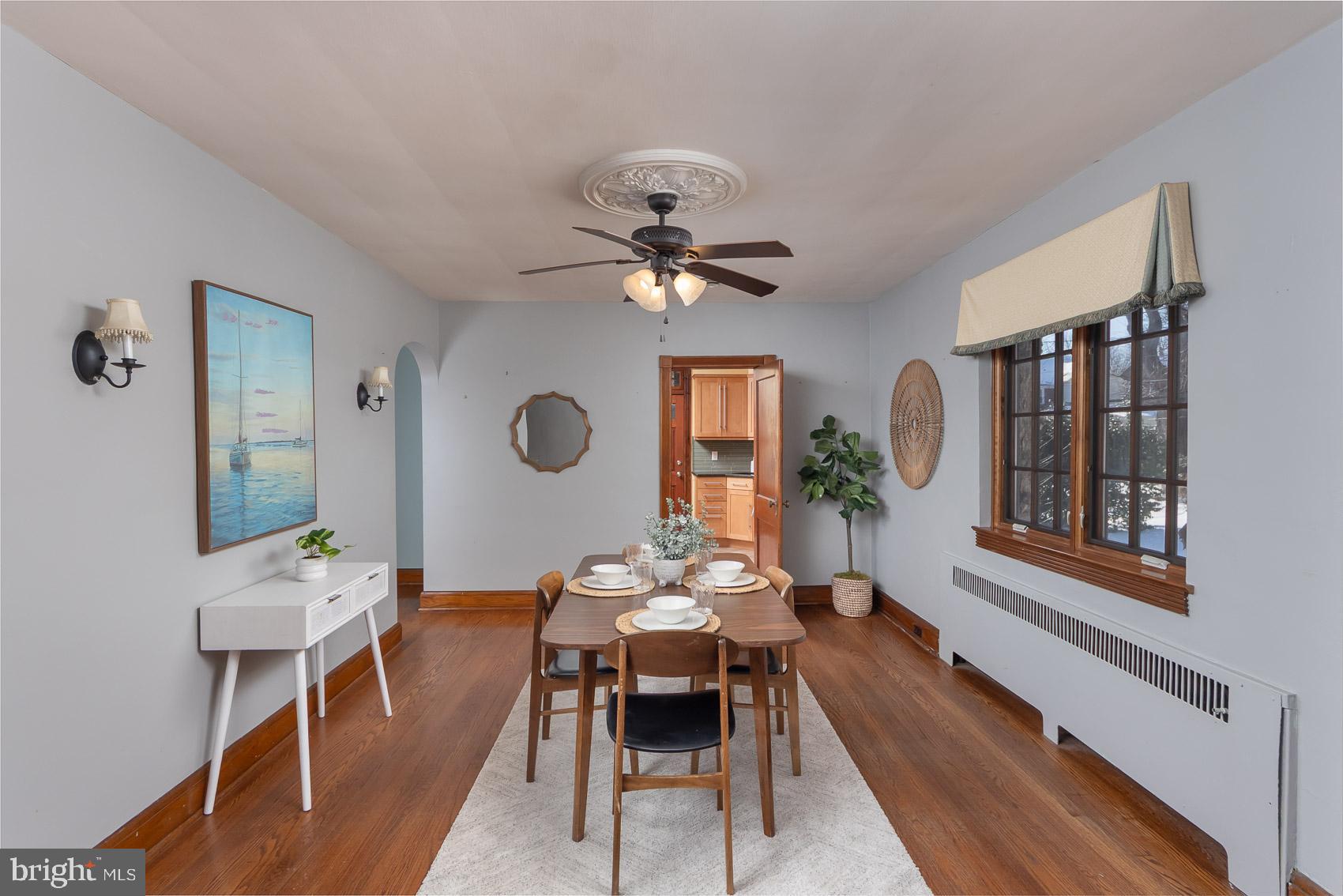 613 Anneslie Road Baltimore, MD 21212 - Photo 7 of 48 a dining room with furniture a window and a chandelier