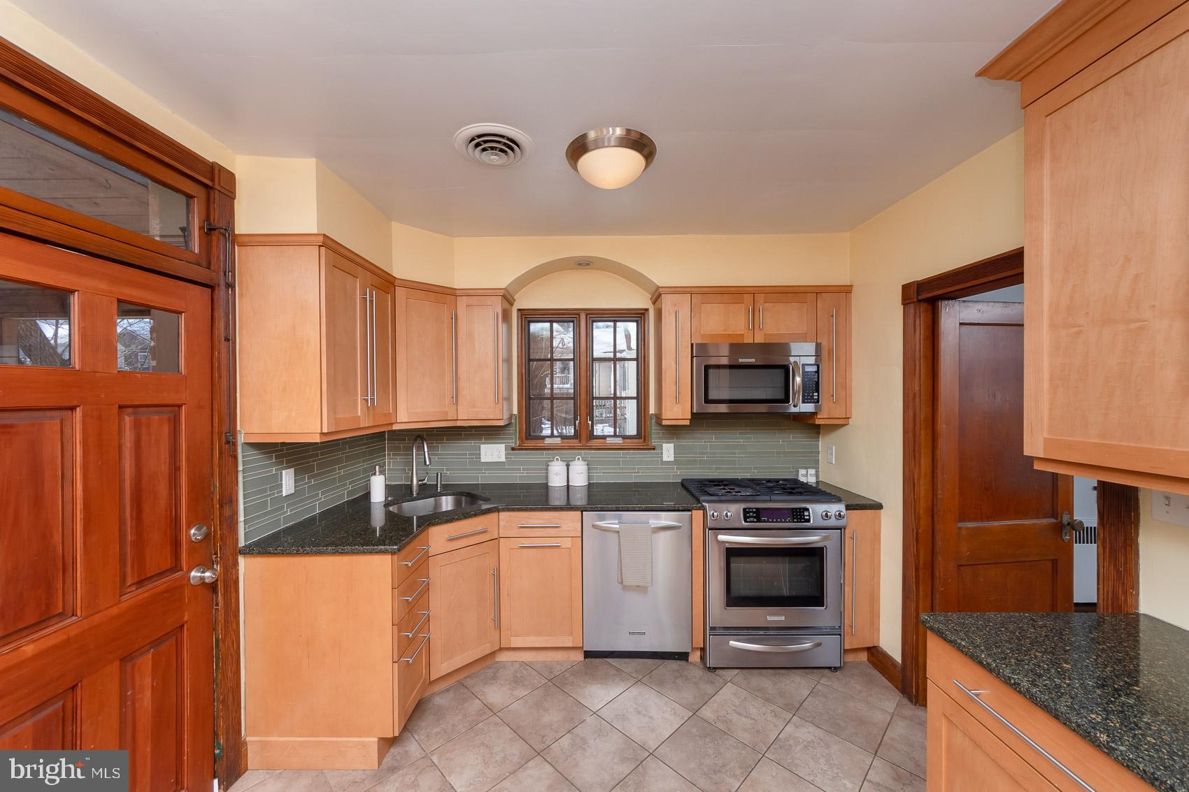 613 Anneslie Road Baltimore, MD 21212 - Photo 10 of 48 a kitchen with a sink stove and refrigerator
