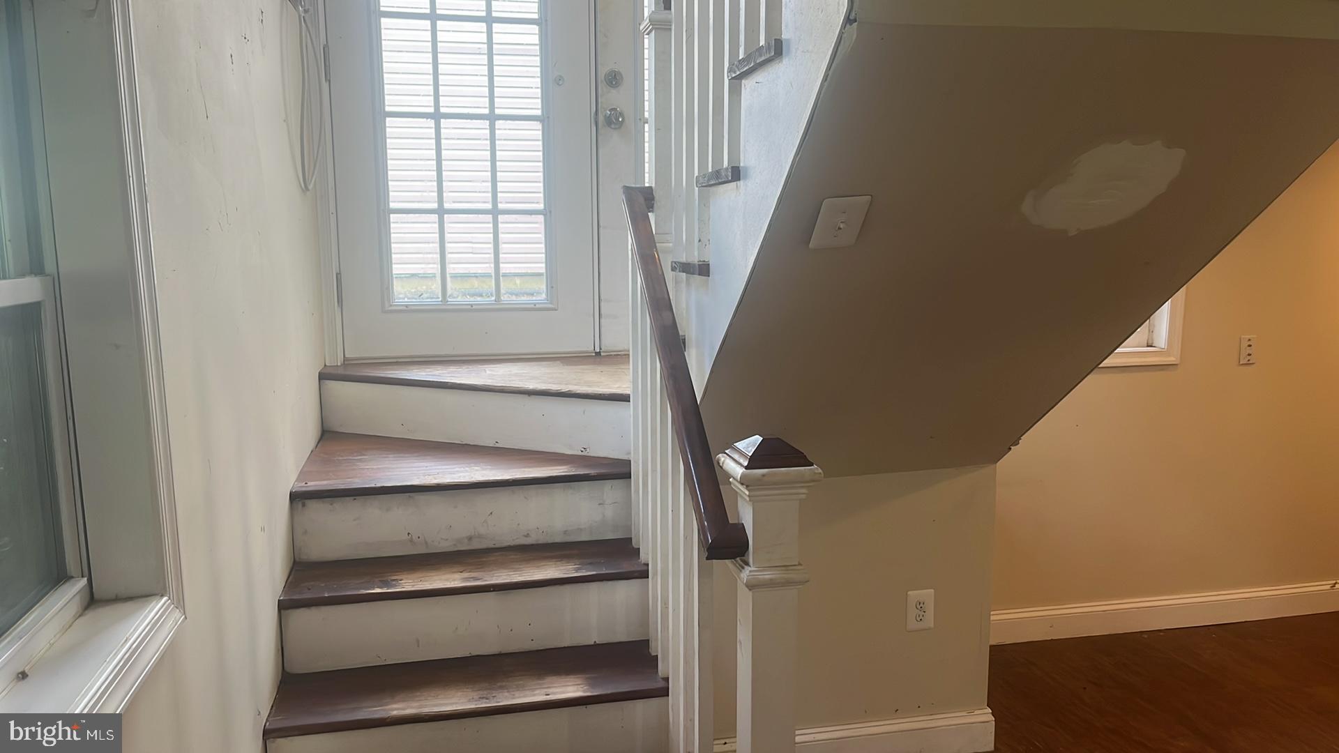 1704 Twickenham Road Pasadena, MD 21122 - Photo 14 of 19 Welcoming entryway with staircase charm.