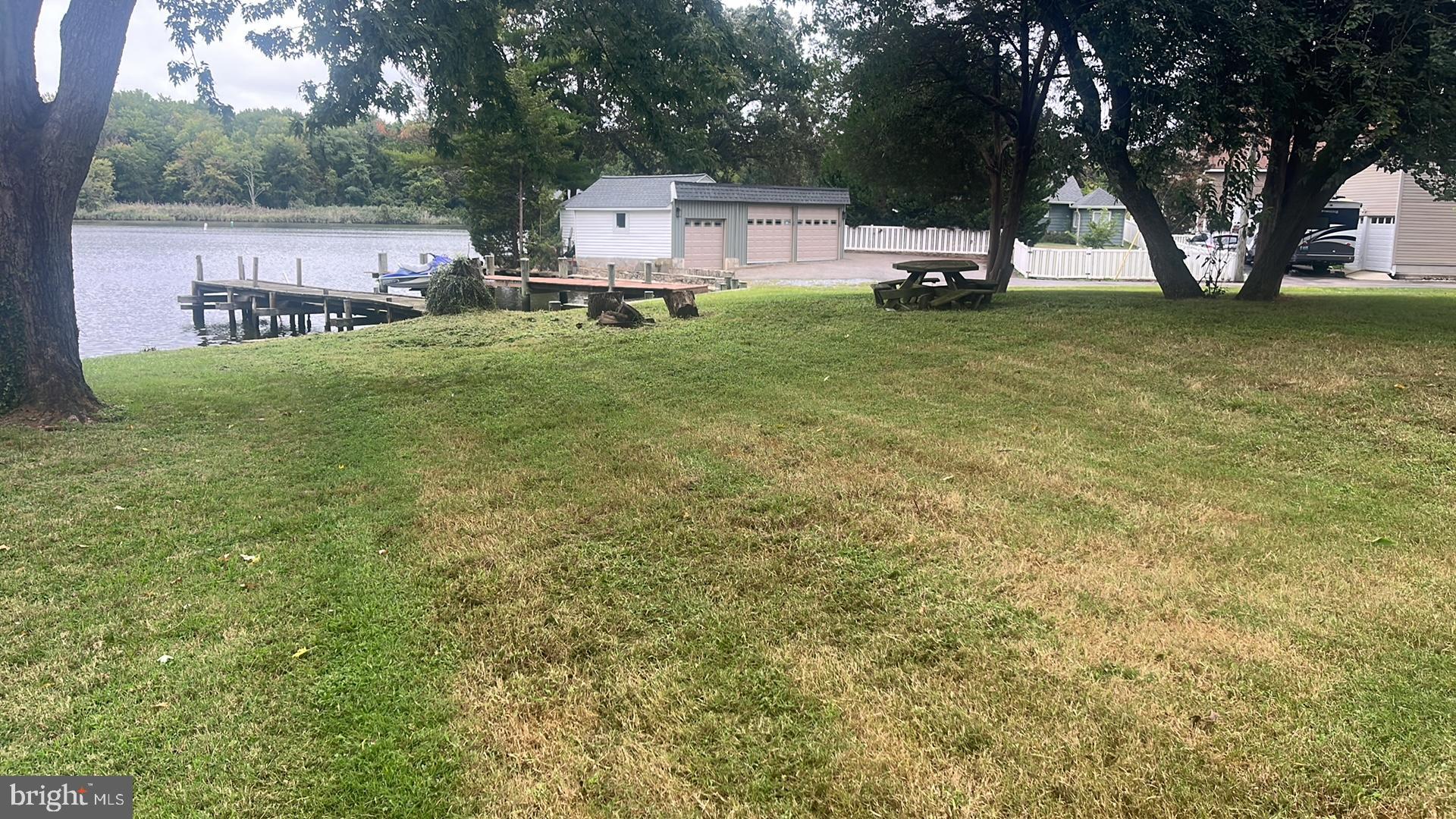 1704 Twickenham Road Pasadena, MD 21122 - Photo 2 of 19 Lush riverside lawn with serene views.