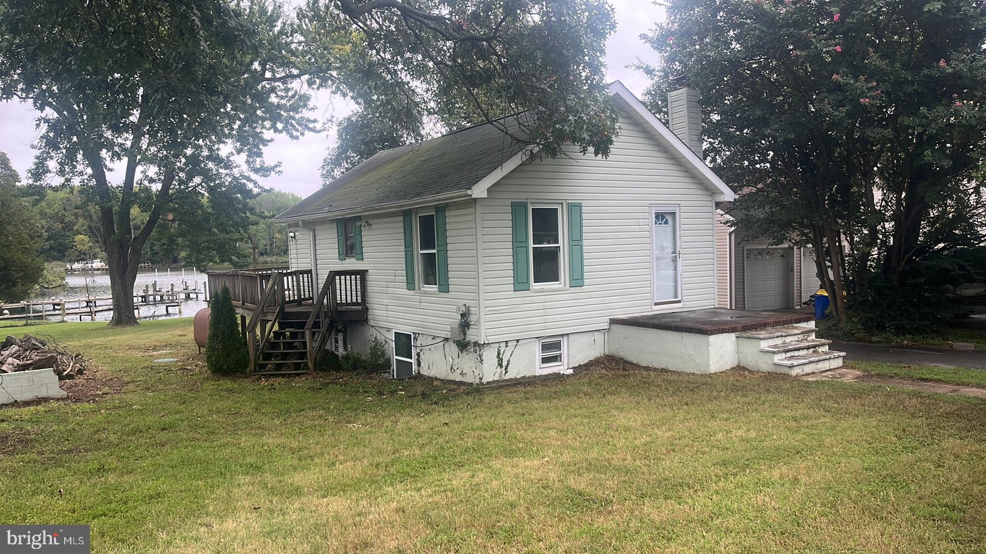 1704 Twickenham Road Pasadena, MD 21122 - Photo 3 of 19 Charming lakeside cottage with inviting porch.