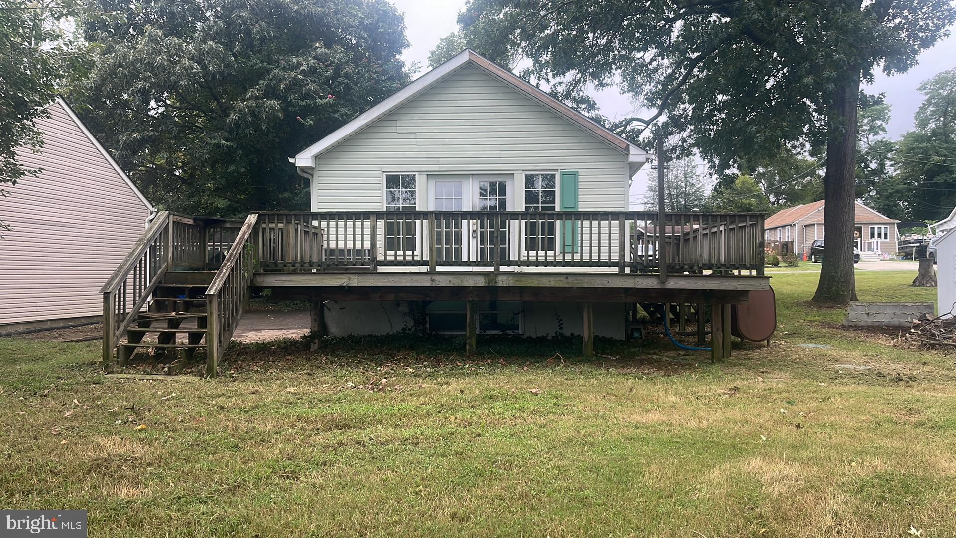 1704 Twickenham Road Pasadena, MD 21122 - Photo 5 of 19 Charming home with spacious deck and greenery.