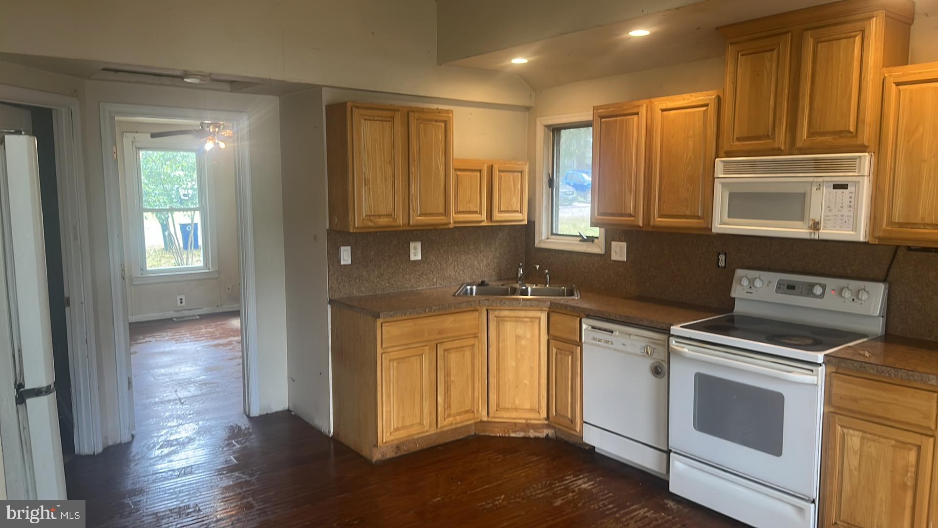 1704 Twickenham Road Pasadena, MD 21122 - Photo 8 of 19 Bright kitchen with warm wood cabinetry.