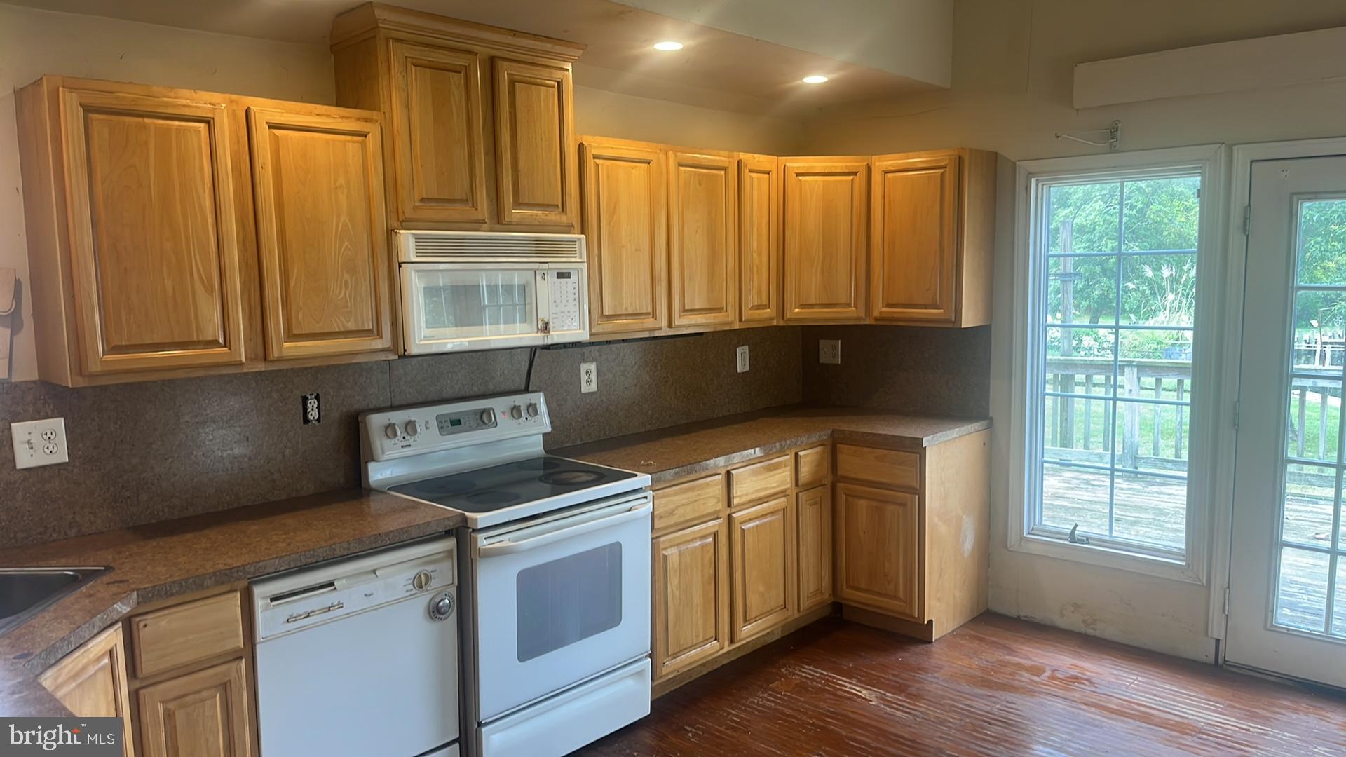 1704 Twickenham Road Pasadena, MD 21122 - Photo 9 of 19 Bright kitchen with warm wood cabinetry.
