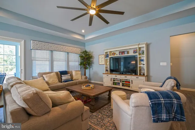 a large kitchen with stainless steel appliances granite countertop a sink and a refrigerator