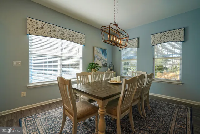 a spacious bedroom with a bed and a window
