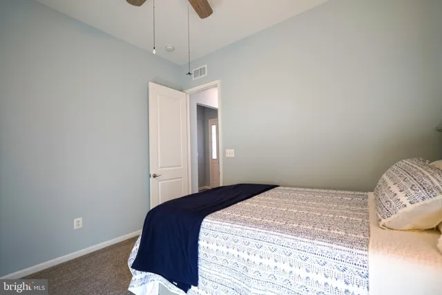 a view of a studio with wooden floor