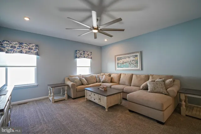 a view of a patio with a table and chairs under an umbrella