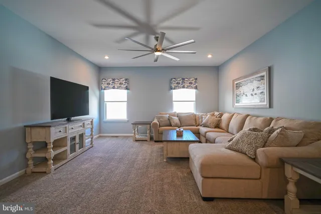 a view of swimming pool with outdoor seating and city view