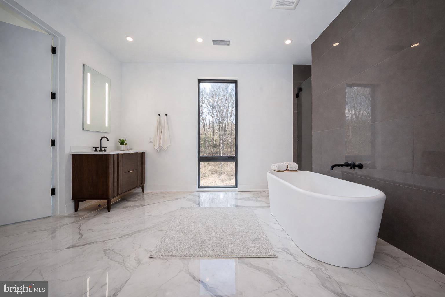 30 East Old Gulph Road Wynnewood, PA 19096 - Photo 8 of 14 a bathroom with a bathtub sink and mirror