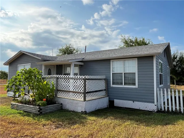 a view of a house with a garden