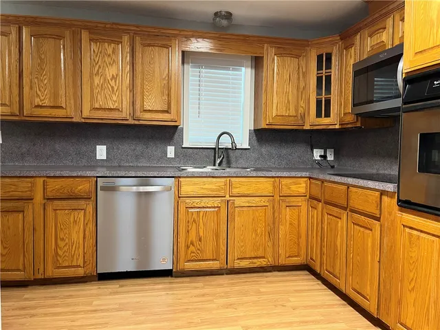 a view of hallway with wooden floor