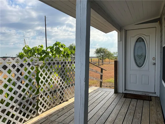a view of a balcony with wooden floor