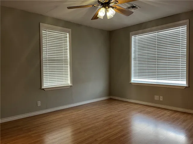 a bathroom with a sink a toilet and vanity