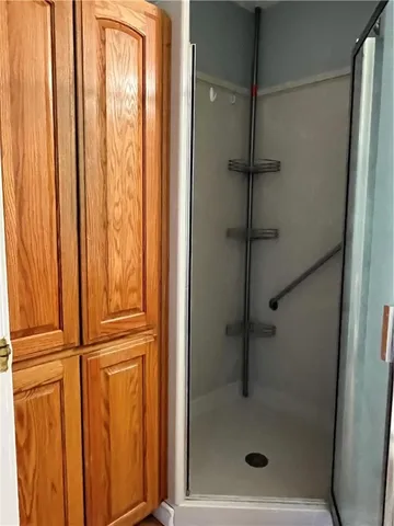 a view of a room with wooden floor