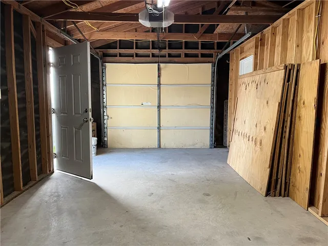a view of dirt yard with large trees