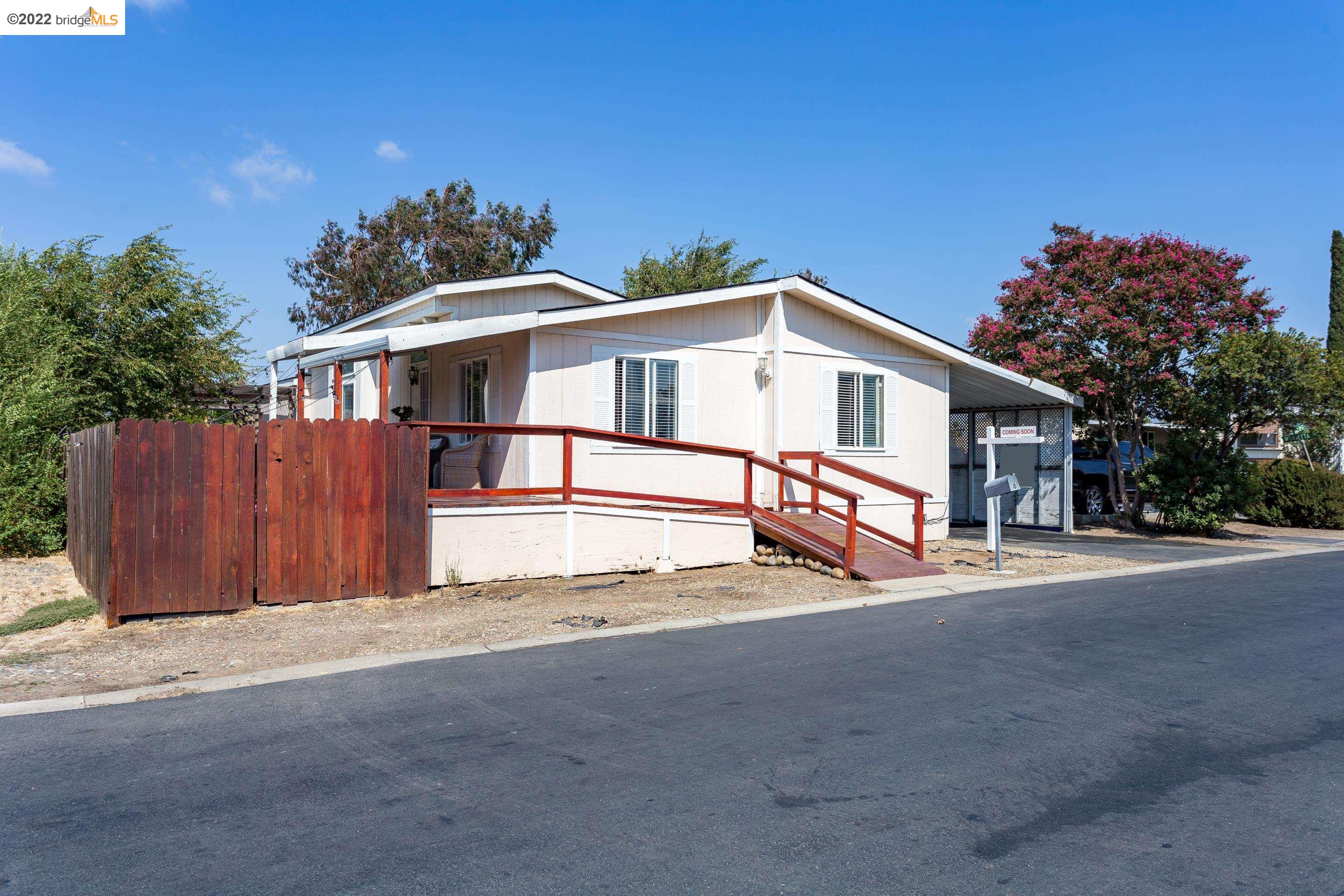 8 Del Rio Pittsburg, CA 94565 - Photo 1 of 1 a front view of a house with a yard and garage