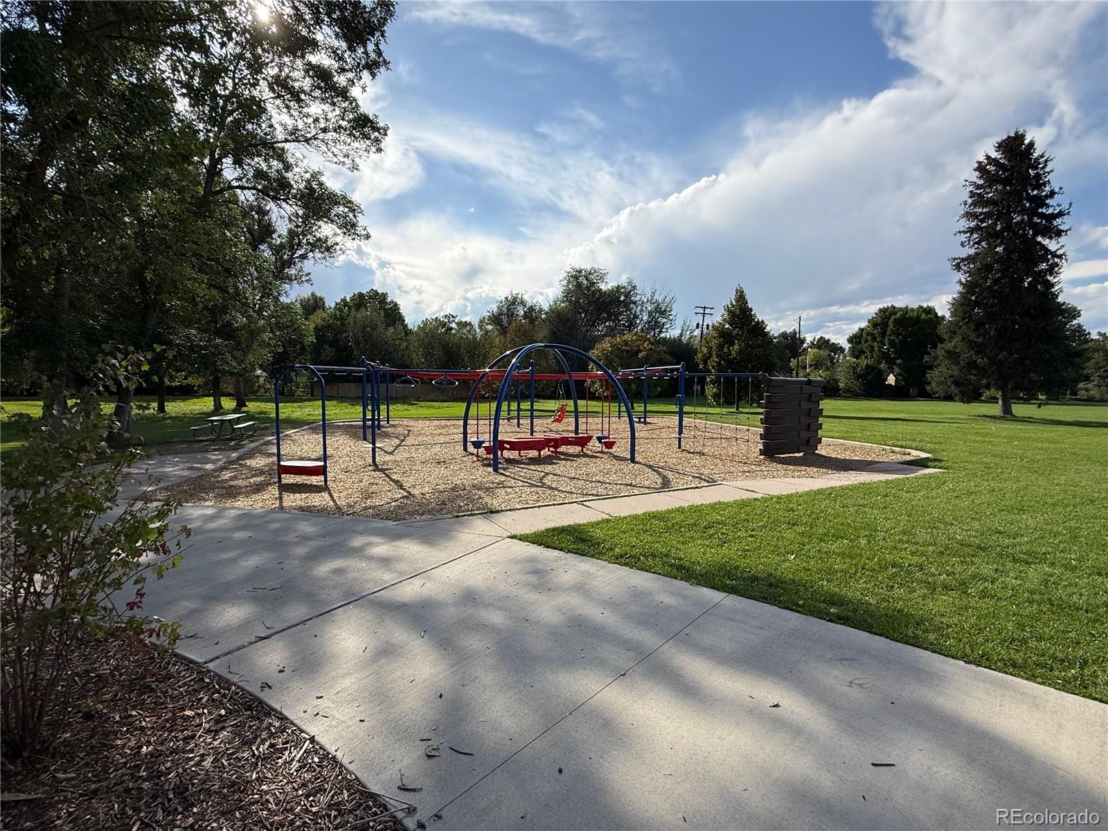 4720 Carr Street Wheat Ridge, CO 80033 - Photo 28 of 31 a view of park with bench and trees