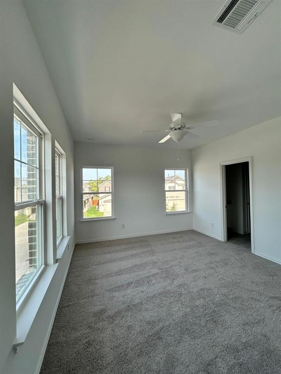 4704 Craymore Road Dallas, TX 75228 - Photo 2 of 14 an empty room with windows and closet