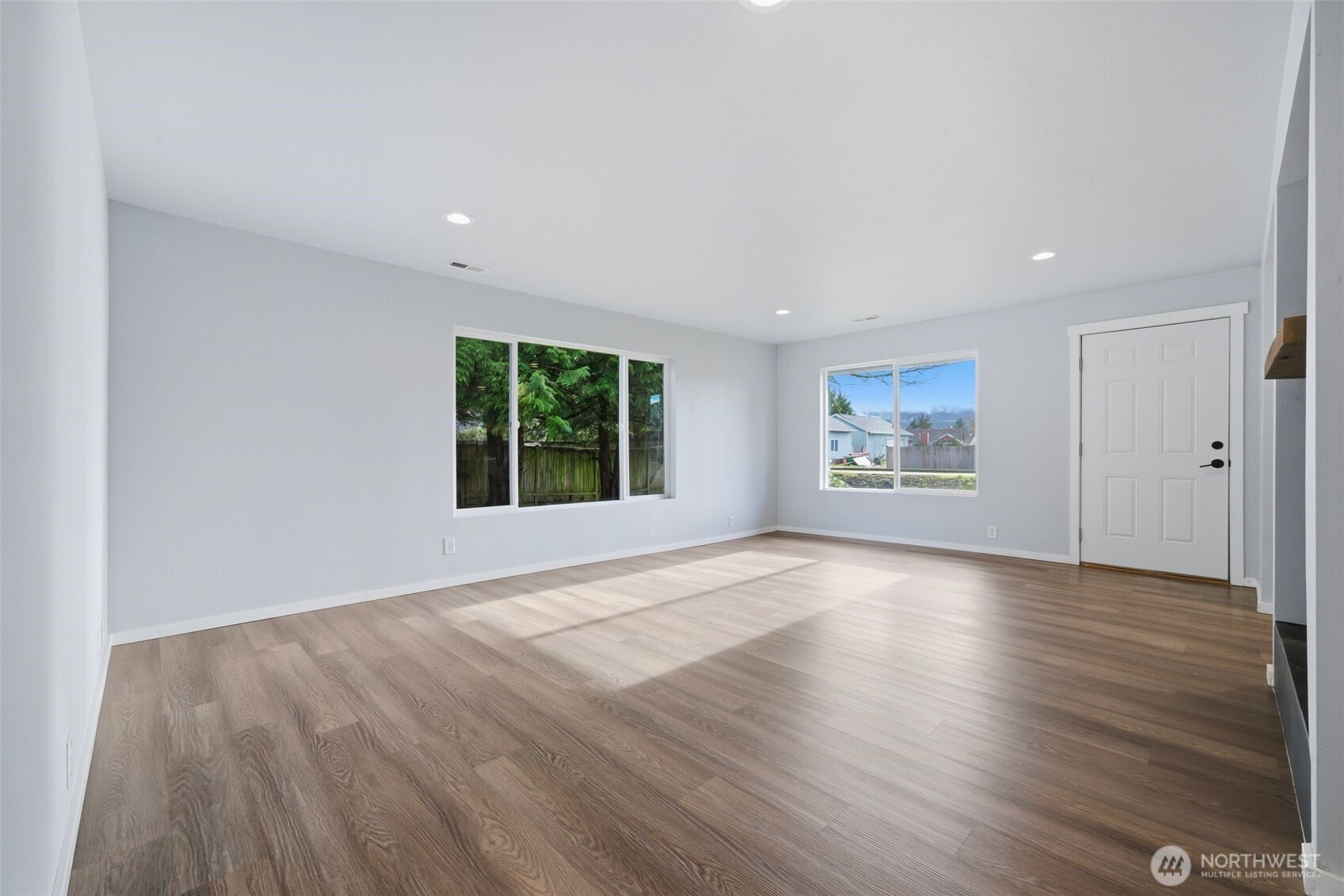 731 High Avenue Sultan, WA 98294 - Photo 11 of 37 an empty room with wooden floor and windows