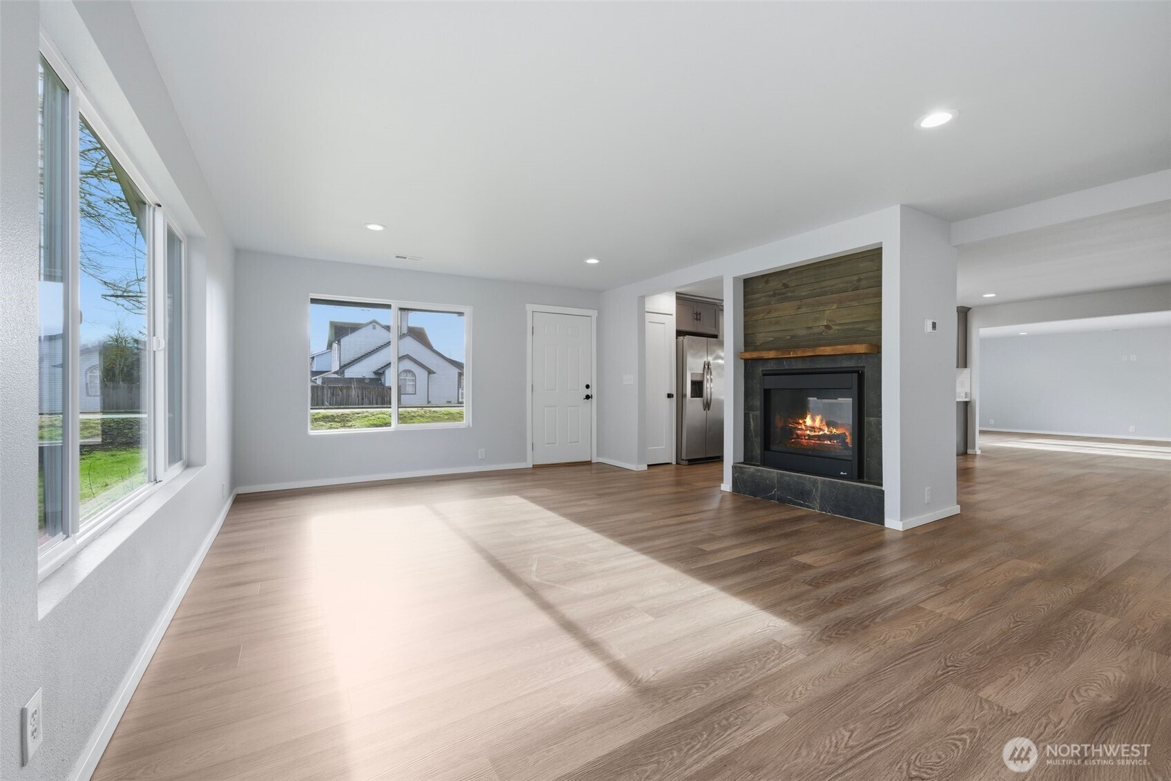 731 High Avenue Sultan, WA 98294 - Photo 12 of 37 an empty room with windows and fireplace