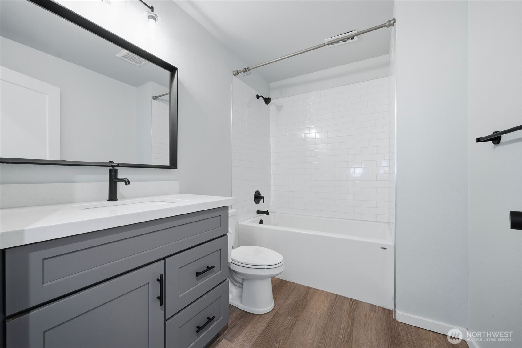 731 High Avenue Sultan, WA 98294 - Photo 18 of 37 a bathroom with a granite countertop sink a toilet and a large mirror
