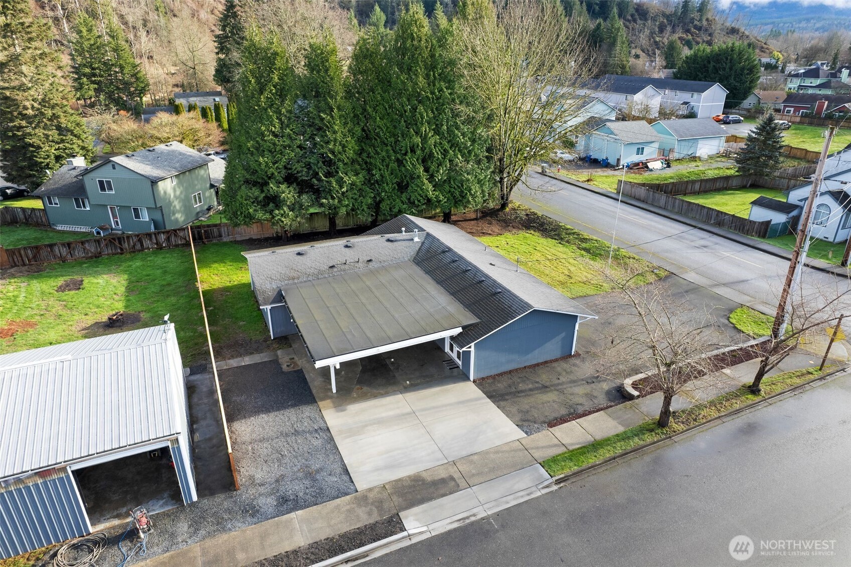 731 High Avenue Sultan, WA 98294 - Photo 25 of 37 an aerial view of a house with a garden and outdoor seating