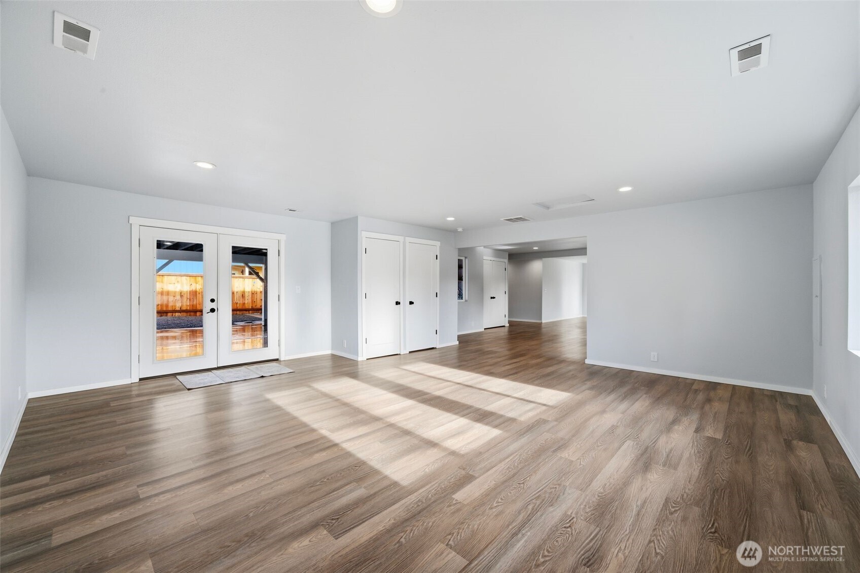 731 High Avenue Sultan, WA 98294 - Photo 4 of 37 a view of an empty room with wooden floor and a window