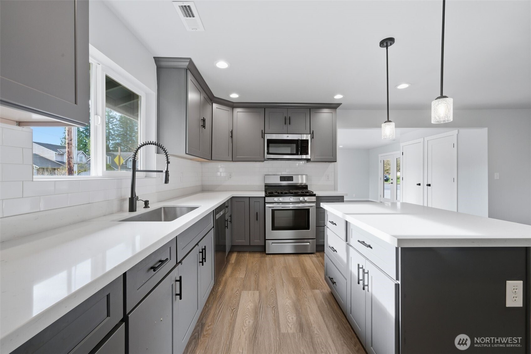 731 High Avenue Sultan, WA 98294 - Photo 5 of 37 a kitchen with kitchen island a sink stainless steel appliances and cabinets