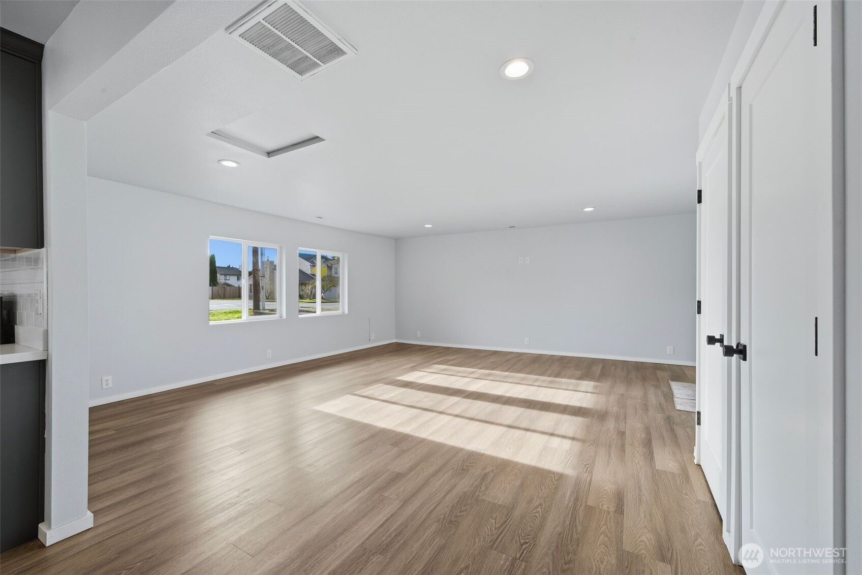 731 High Avenue Sultan, WA 98294 - Photo 6 of 37 a view of empty room with wooden floor and fan