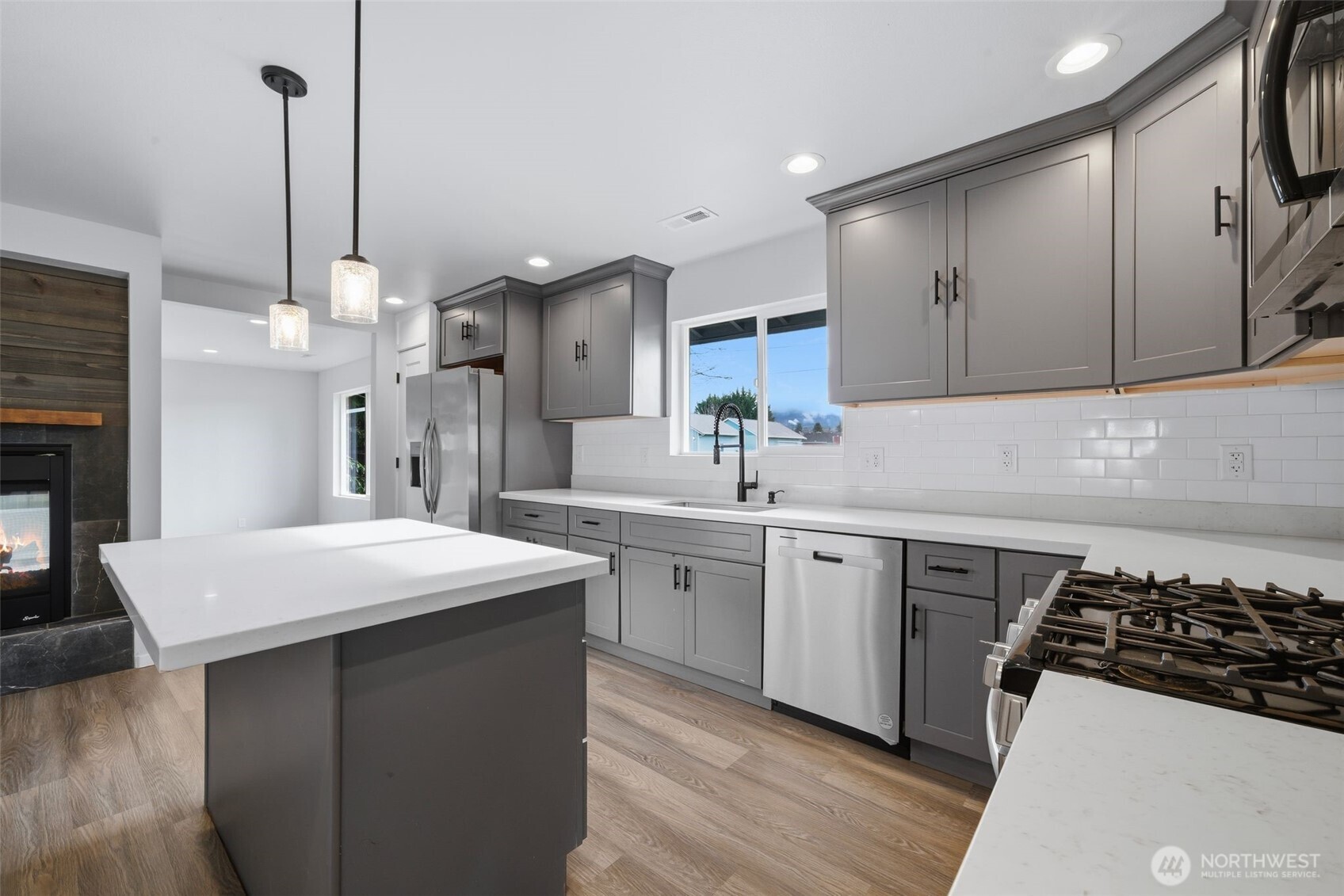 731 High Avenue Sultan, WA 98294 - Photo 7 of 37 a kitchen with a sink stove and cabinets