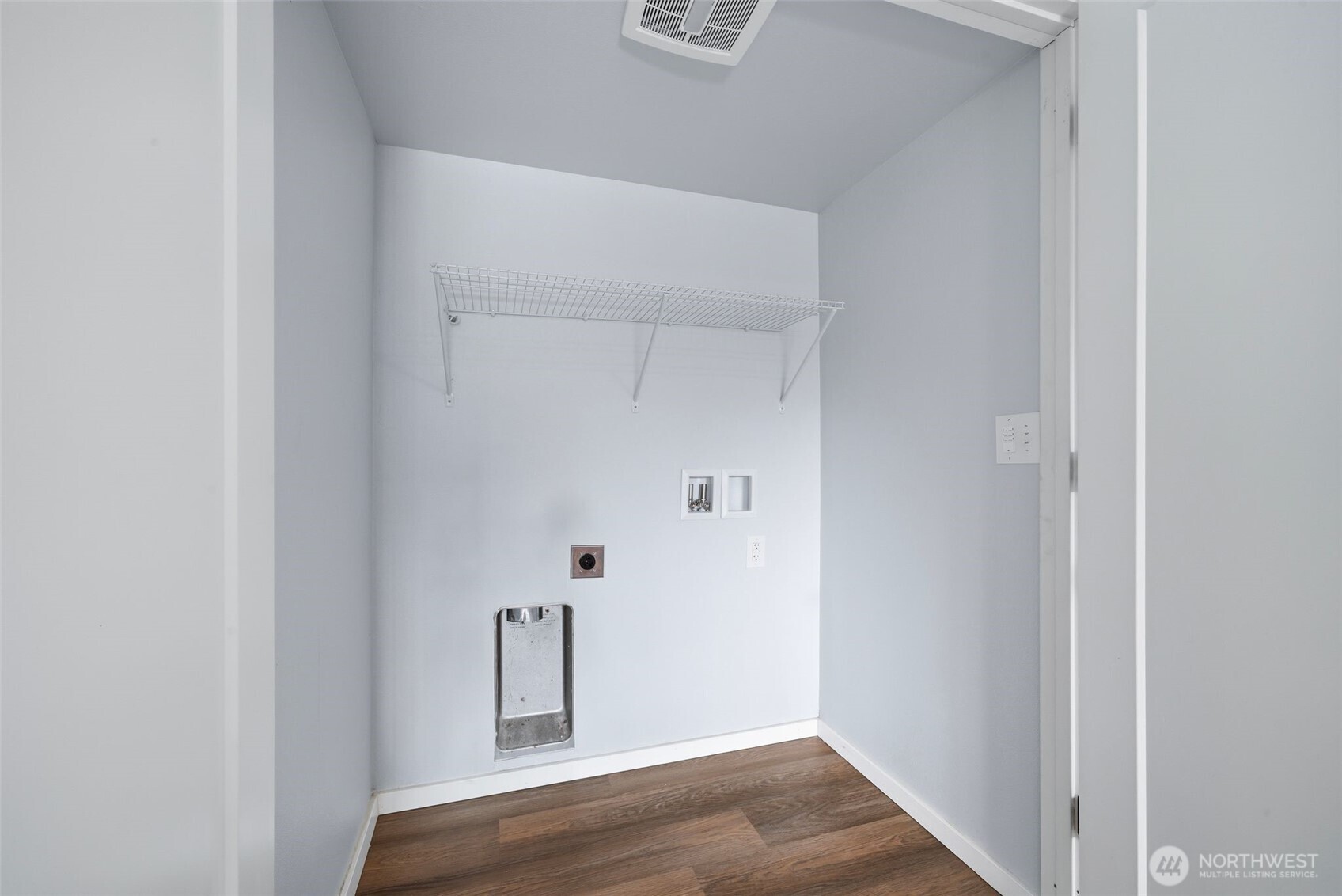 731 High Avenue Sultan, WA 98294 - Photo 9 of 37 a view of an empty room with wooden floor and a window