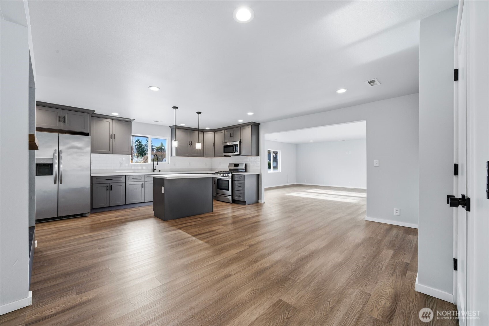 731 High Avenue Sultan, WA 98294 - Photo 10 of 37 a kitchen with stainless steel appliances a sink cabinets and wooden floor