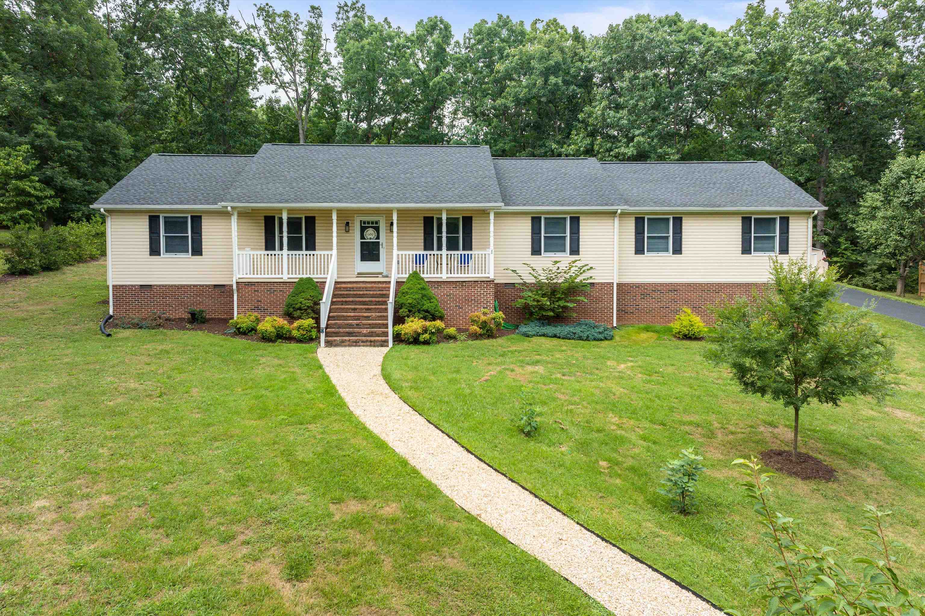 31 Folly Mills Station Road Staunton, VA 24401 - Photo 2 of 48 a front view of a house with a yard porch and green space