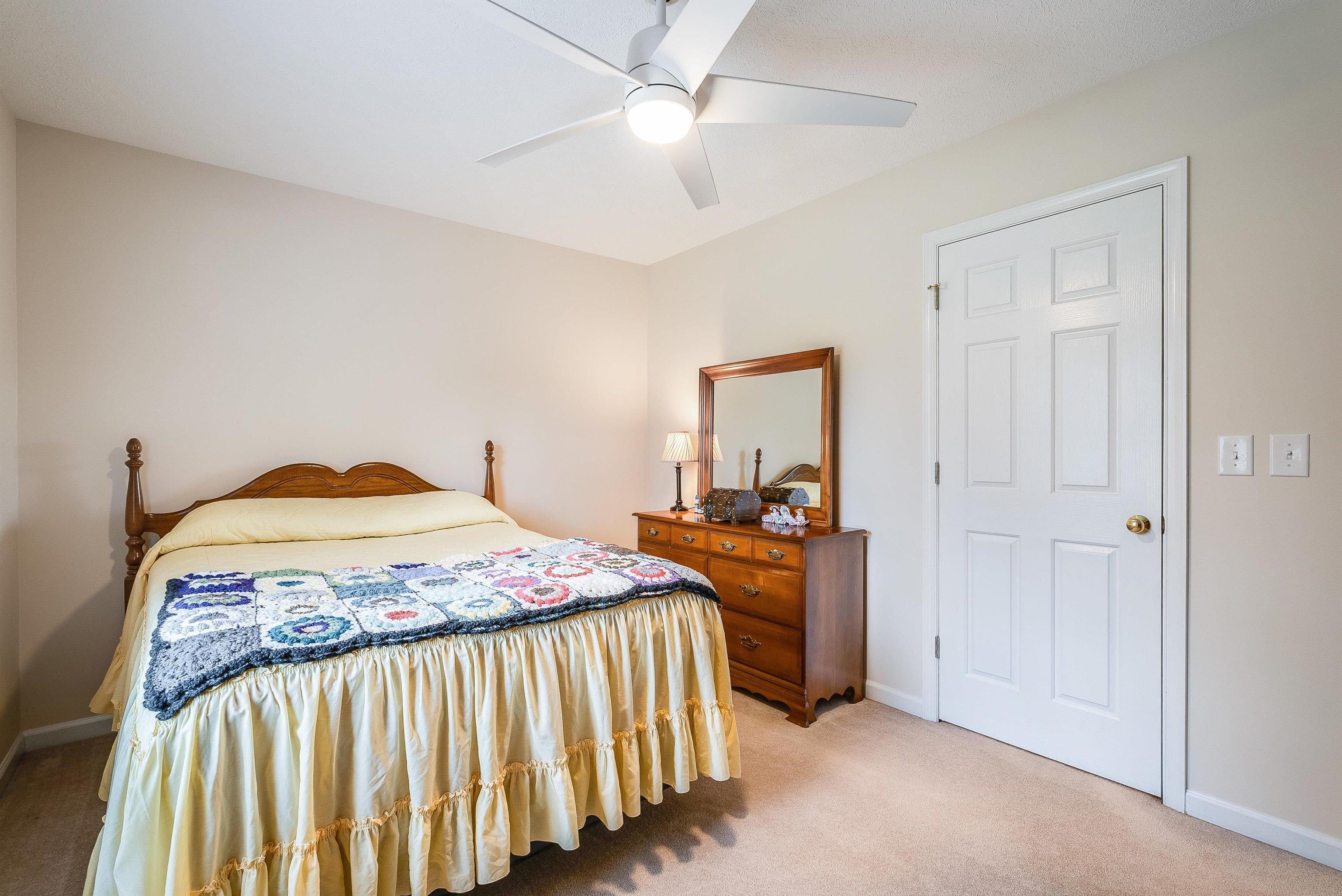31 Folly Mills Station Road Staunton, VA 24401 - Photo 26 of 48 a bedroom with a bed and a chandelier
