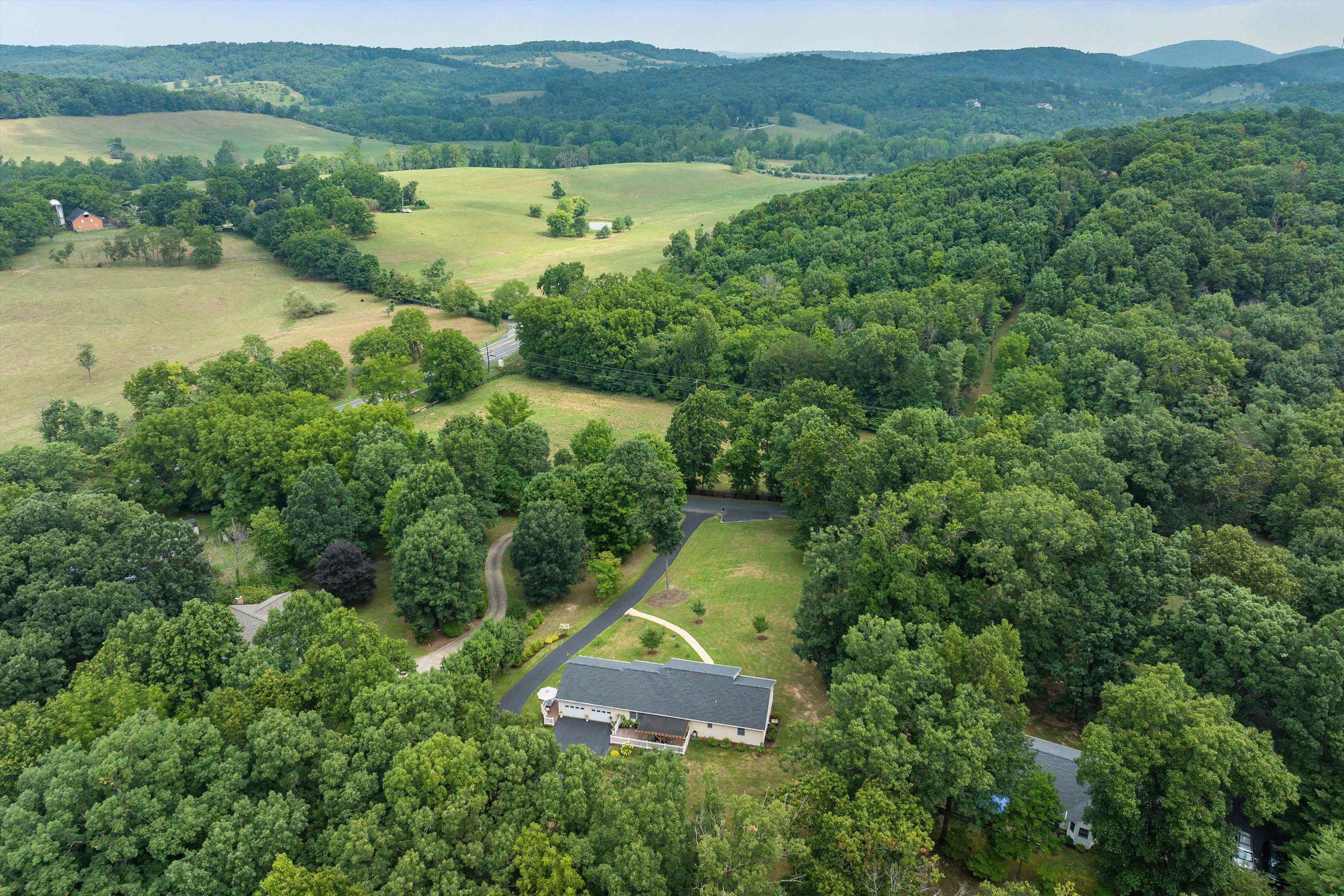 31 Folly Mills Station Road Staunton, VA 24401 - Photo 48 of 48 an aerial view of a house with a yard and lake view