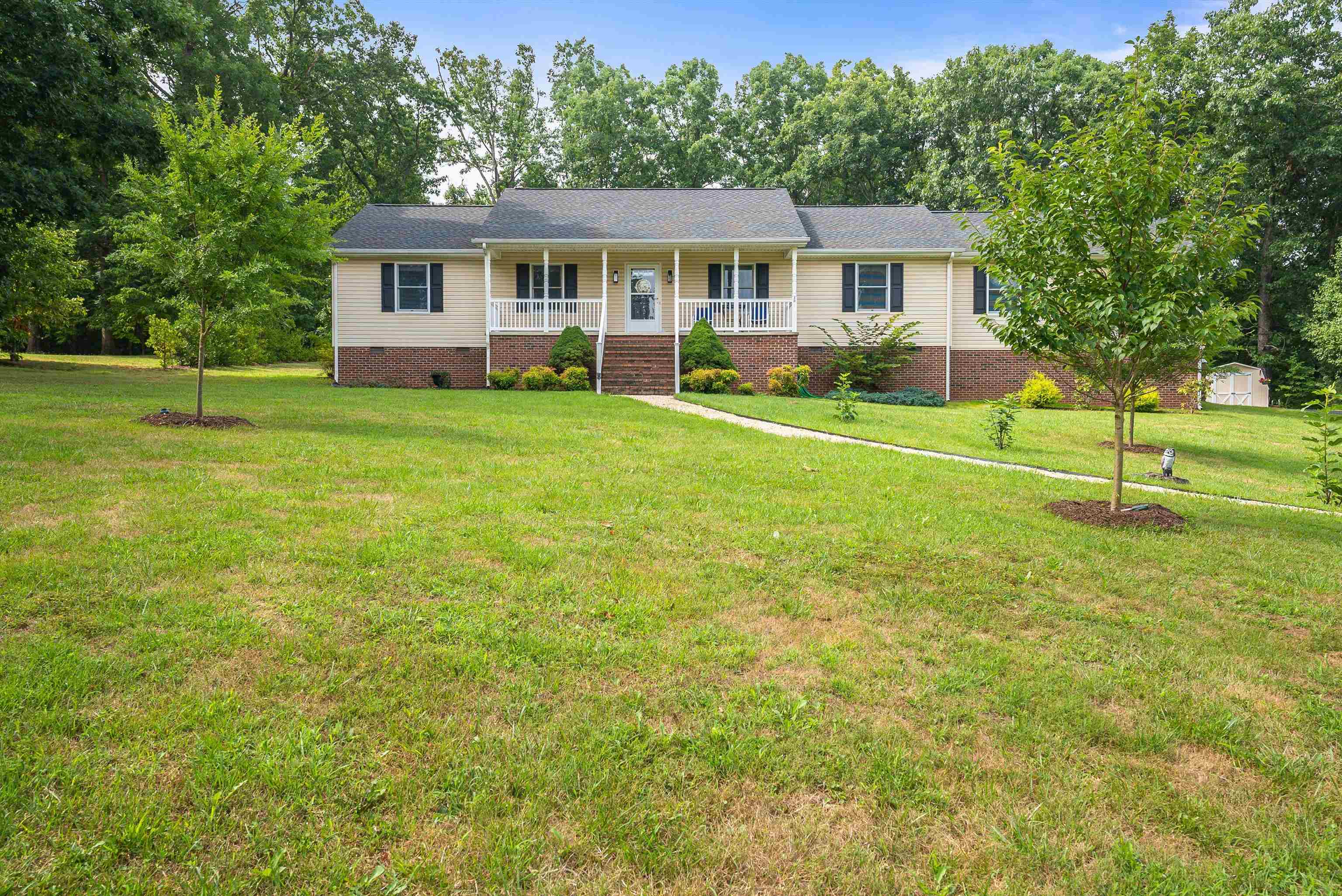 31 Folly Mills Station Road Staunton, VA 24401 - Photo 7 of 48 a front view of a house with a yard table and chairs