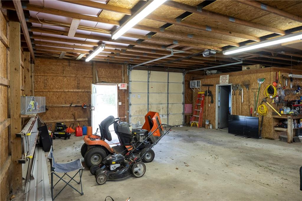 9133 South Watson Run Road Meadville, PA 16335 - Photo 34 of 45 a view of a garage with a table and a chair