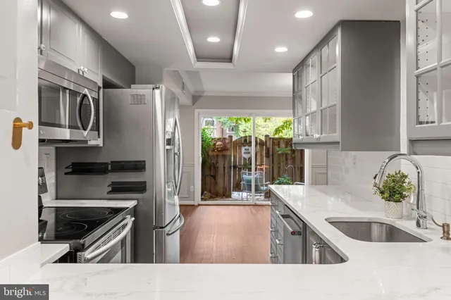 a view of a chair and table in the backyard