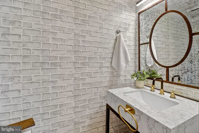 a view of staircase with white walls and a window