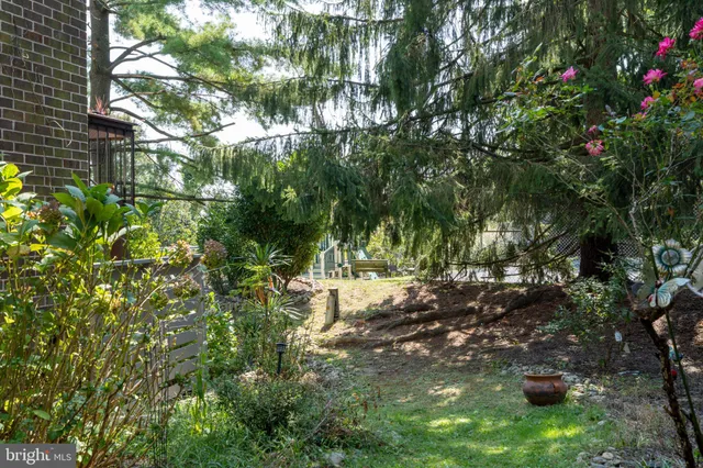 a view of a kitchen with a sink and a washer dryer