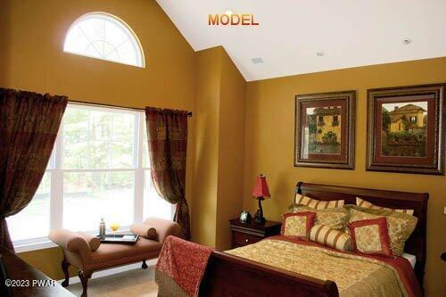 210 Braeburn Path Matamoras, PA 18336 - Photo 8 of 14 a bedroom with a bed and wooden floor