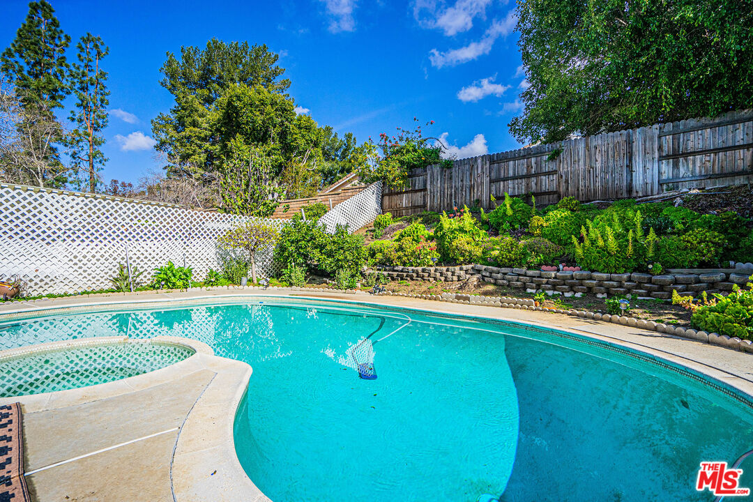 20807 Canyon Ridge Road Diamond Bar, CA 91789 - Photo 15 of 16 a view of a swimming pool with a patio