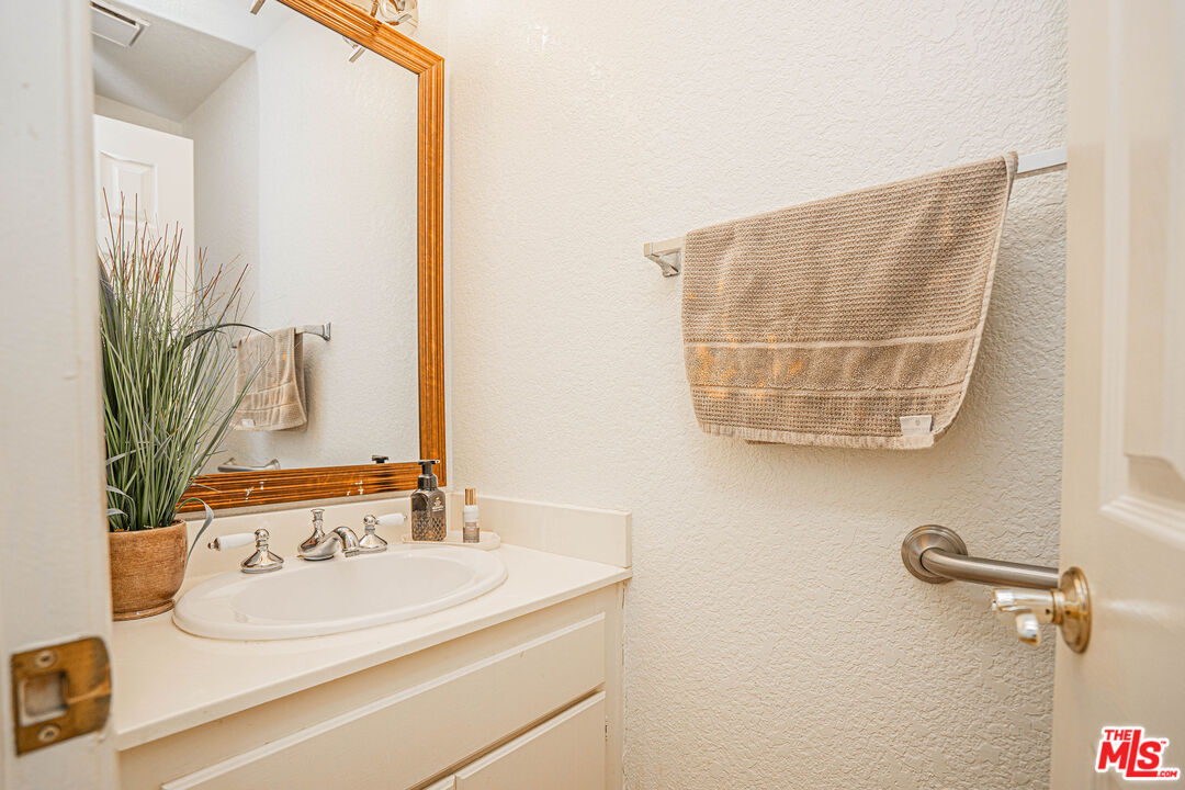 20807 Canyon Ridge Road Diamond Bar, CA 91789 - Photo 7 of 16 a bathroom with a sink and a mirror