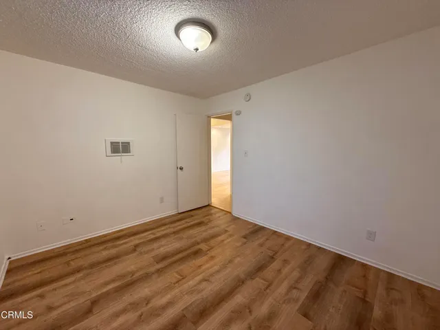 an empty room with a empty space and a window