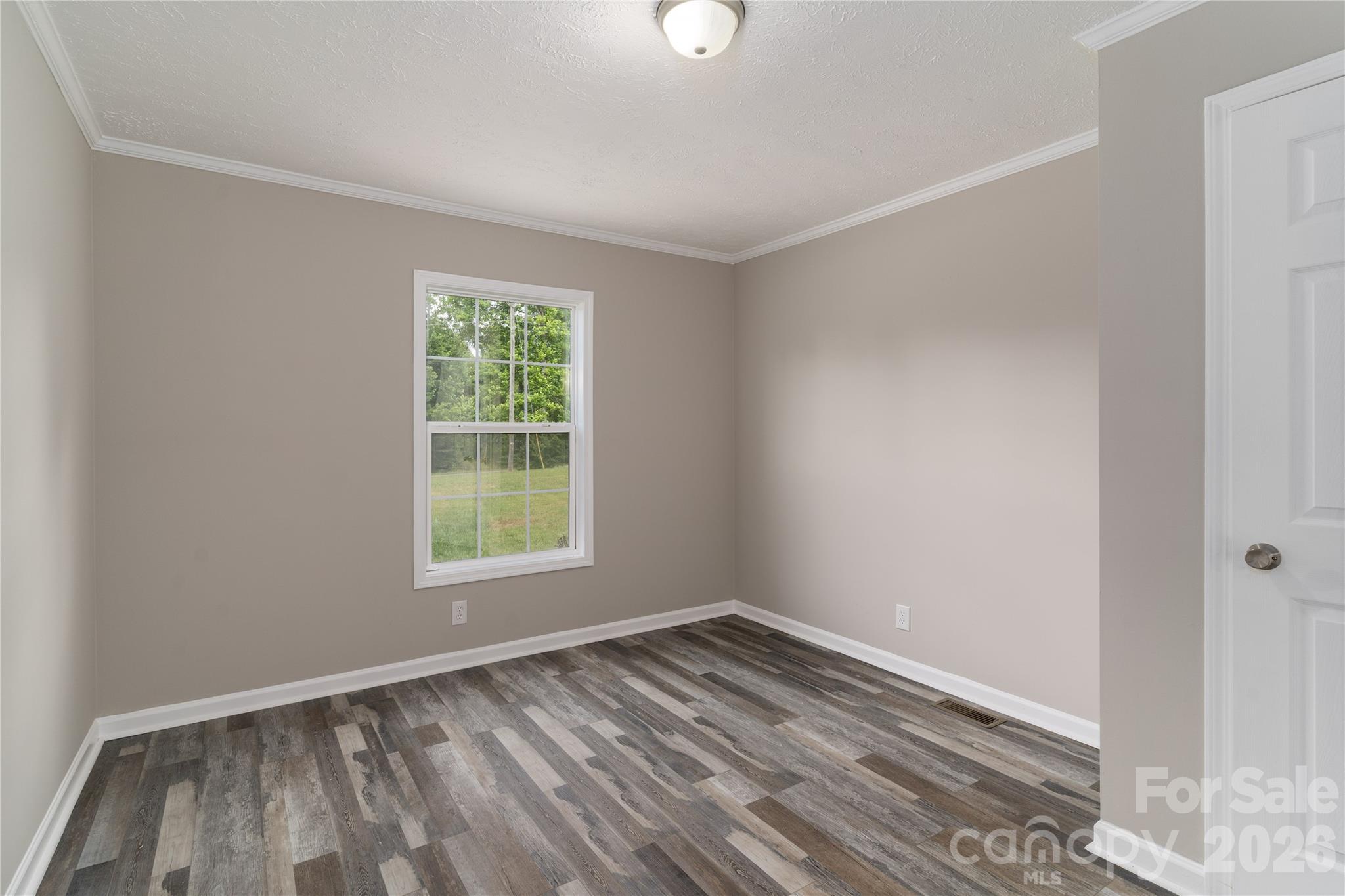 922 Lavender Road Grover, NC 28073 - Photo 24 of 43 a view of empty room with wooden floor